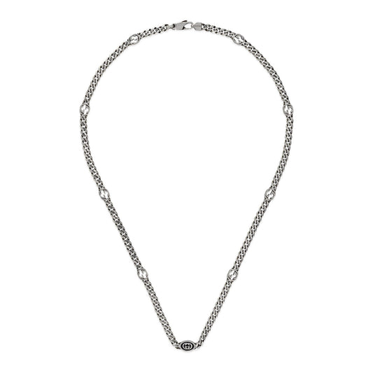 The Gucci Interlocking G Sterling Silver Station Necklace from GUCCI Fine Jewellery showcases small, round decorative elements evenly spaced along the chain. A clasp ensures secure wear at the top, while its elegant and minimalist design is accentuated by the iconic Interlocking G.