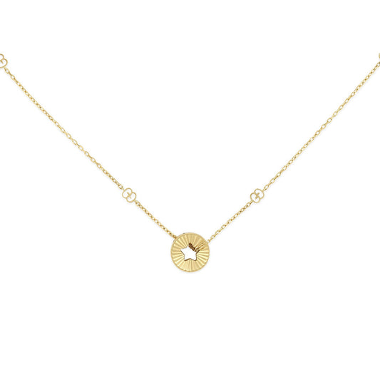 A Gucci Icon Star 18K Yellow Gold Necklace Pendant from GUCCI Fine Jewellery showcases a fine 18K yellow gold chain centered with a round, textured pendant featuring a star-shaped cutout, complemented by two small decorative rings spaced along the chain.