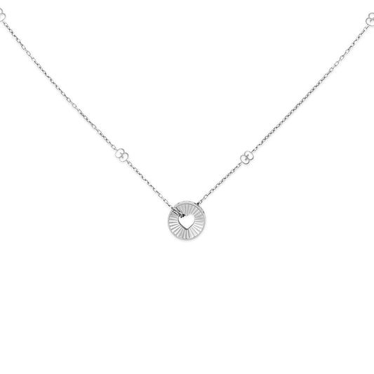The Gucci Icon Heart 18K White Gold Necklace Pendant from GUCCI Fine Jewellery is a delicate piece featuring an 18K white gold circular pendant with a small heart cutout at its center. Its elegant design includes a chain with small circular links, beautifully showcased on a white background.