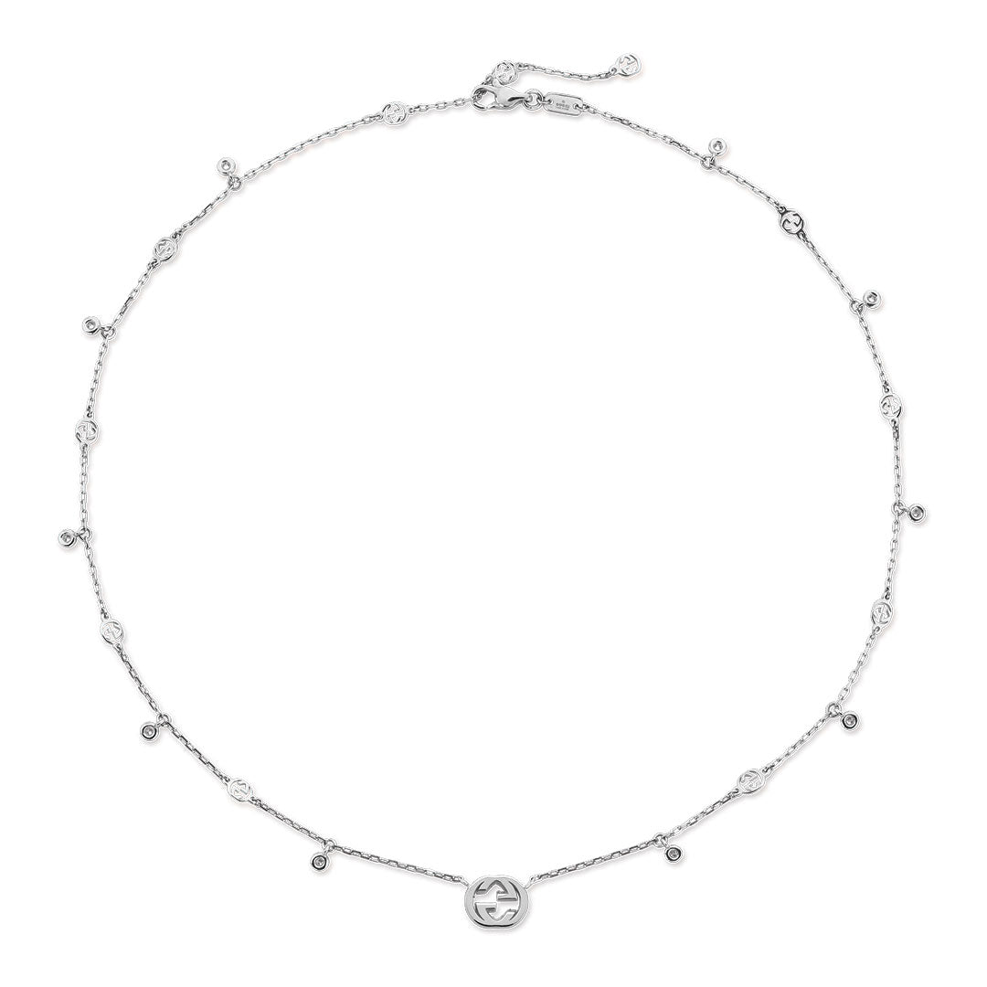 The Gucci Interlocking G 18K White Gold Diamond Station Necklace Pendant by GUCCI Fine Jewellery features elegant round diamond stations and a striking Interlocking G logo centerpiece.