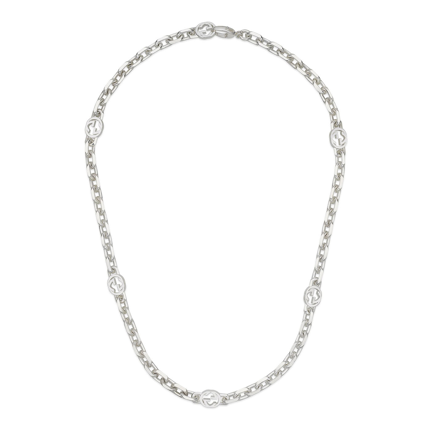 Introducing the Gucci Interlocking G Sterling Silver Chain Station Necklace from GUCCI Fine Jewellery. Crafted from 925 sterling silver, this necklace showcases interlocking G motif links placed at spaced intervals. The design seamlessly combines elegant and modern elements, with a polished finish that enhances its sophisticated appearance, all set against a plain white background.