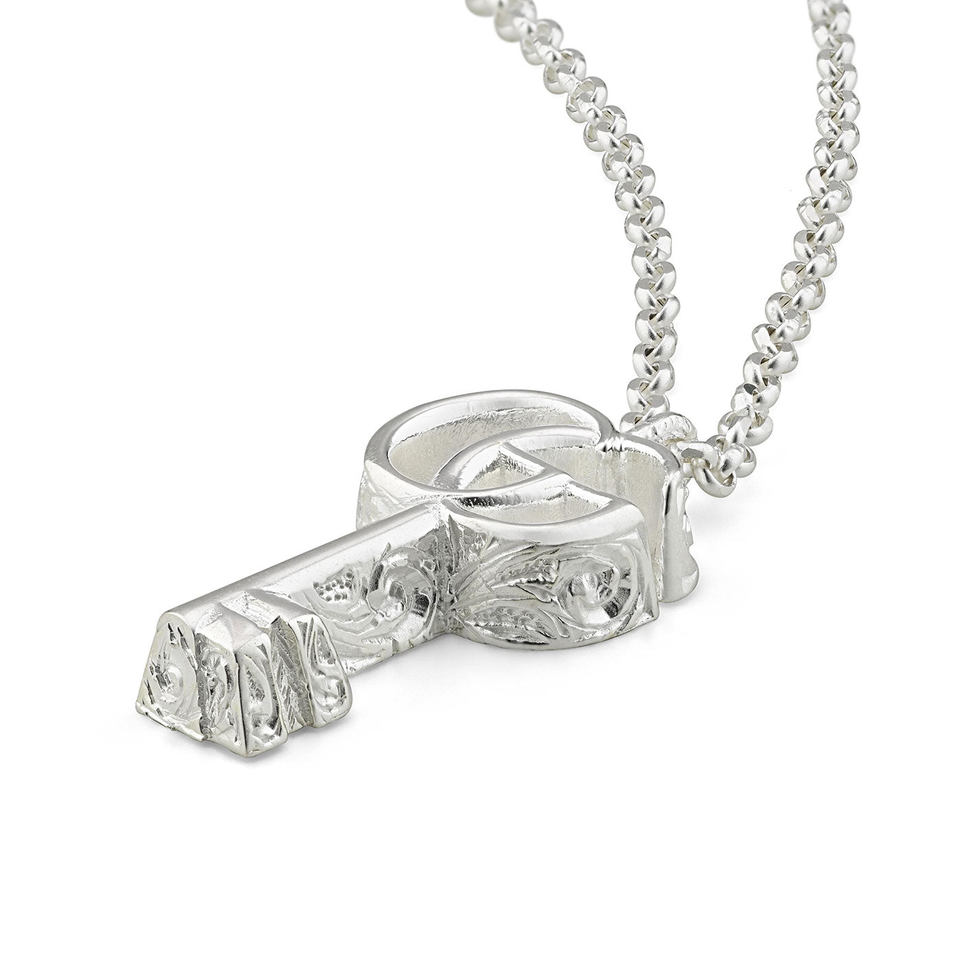 Introducing the Gucci GG Marmont Key Charm Sterling Silver Necklace Pendant by GUCCI Fine Jewellery, featuring a finely crafted key-shaped pendant hanging from a beaded chain. The pendant showcases intricate engravings and a polished finish that elegantly captures and reflects light, reminiscent of Gucci jewelry essence.