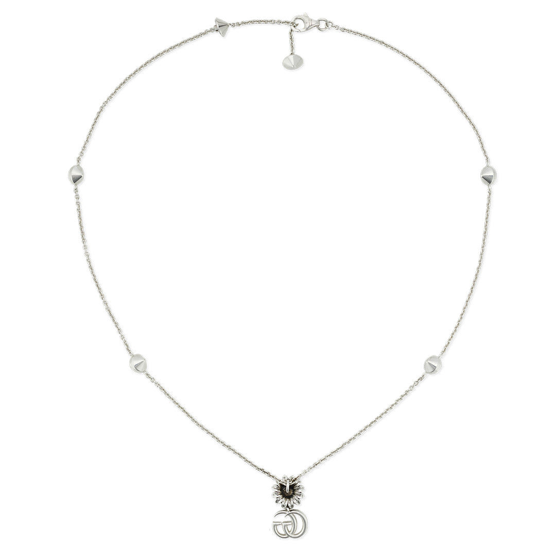 The Gucci GG Marmont Sterling Silver Necklace Pendant by GUCCI Fine Jewellery showcases a silver chain with small geometric beads, centering a lion's head pendant with interlocking Double G initials and finished with a lobster clasp closure.