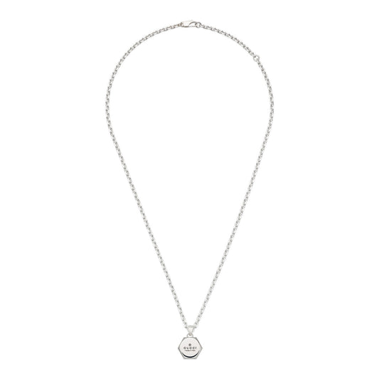 The Gucci Trademark Sterling Silver Necklace by GUCCI Fine Jewellery features a hexagonal pendant engraved with the Gucci logo. It has an adjustable chain with a simple clasp, showcasing a minimalist and elegant design.