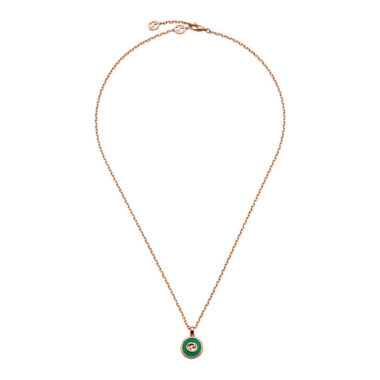 The Gucci Interlocking 18K Rose Gold Chain Necklace by GUCCI Fine Jewellery features a circular green agate pendant adorned with the iconic interlocking G logo. The adjustable chain necklace includes a simple clasp for versatile wear.