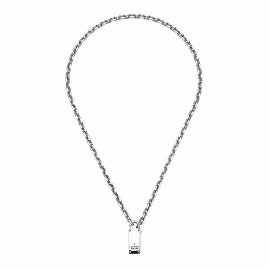 This sterling silver necklace from GUCCI Fine Jewellery features a medium-length chain adorned with a rectangular pendant engraved with the iconic "Gucci" near the base. Embrace the elegance of the Gucci Trademark Sterling Silver Chain Necklace Pendant with Padlock from the Pre-Fall 2024 collection as it gleams with a shiny finish at the center of your ensemble.