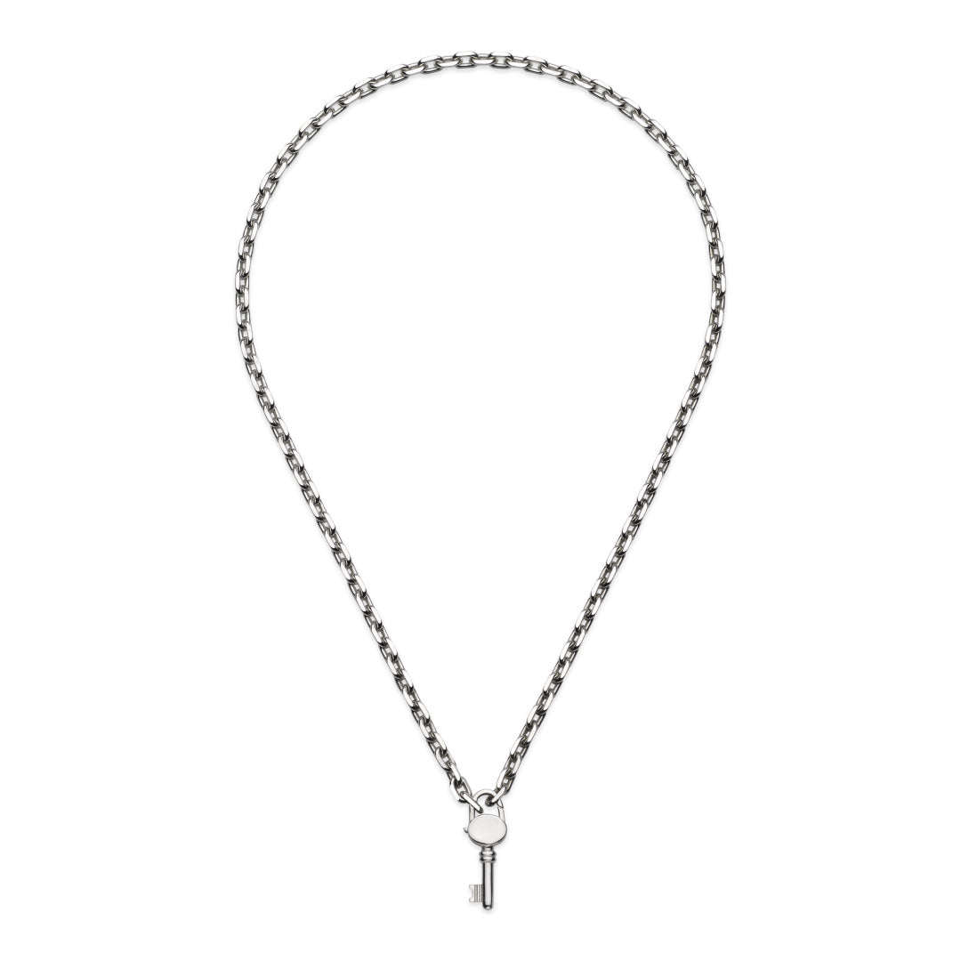 The GUCCI Fine Jewellery Trademark Sterling Silver Necklace Pendant boasts a delicate key charm against a white backdrop.