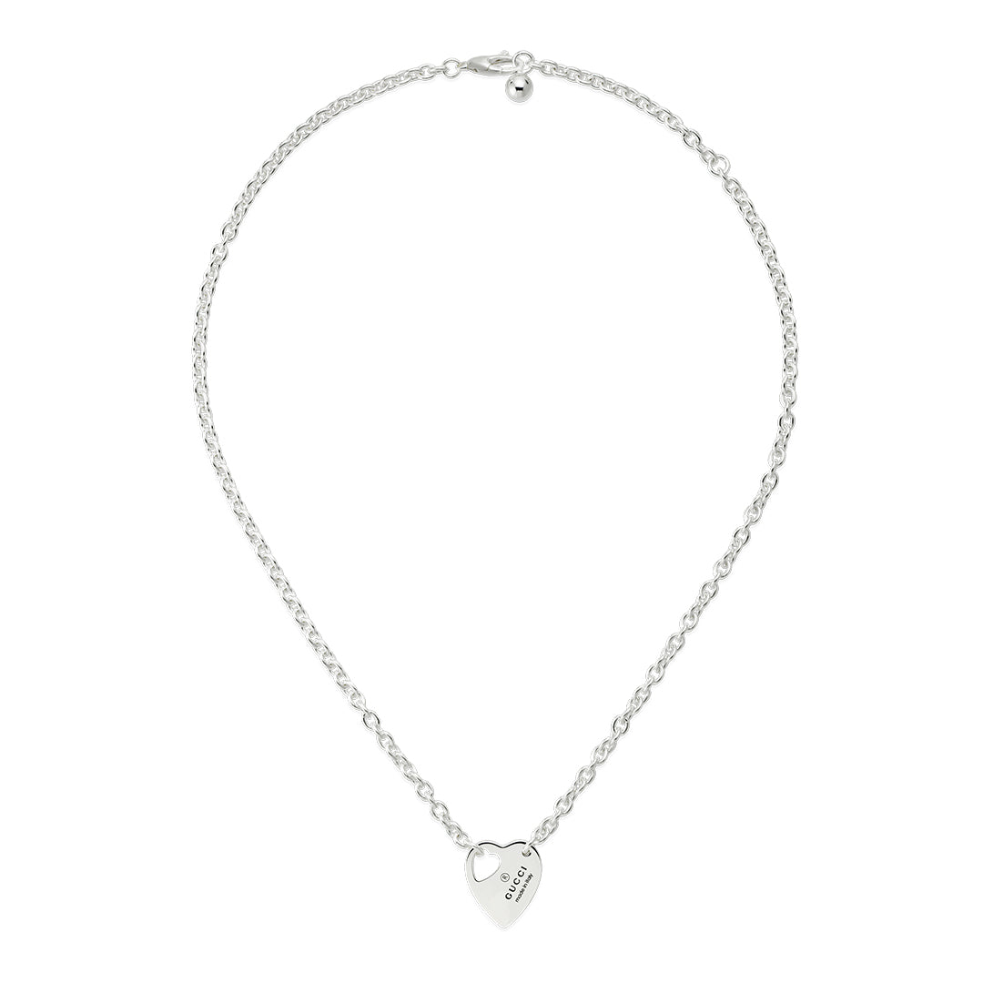 A GUCCI Fine Jewellery necklace, the Gucci Trademark Sterling Silver Chain Necklace Pendant, showcases a heart-shaped pendant with "GUESS 1981" inscribed at its center, elegantly suspended from a delicate linked chain.