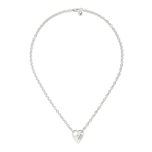 A GUCCI Fine Jewellery necklace, the Gucci Trademark Sterling Silver Chain Necklace Pendant, showcases a heart-shaped pendant with "GUESS 1981" inscribed at its center, elegantly suspended from a delicate linked chain.