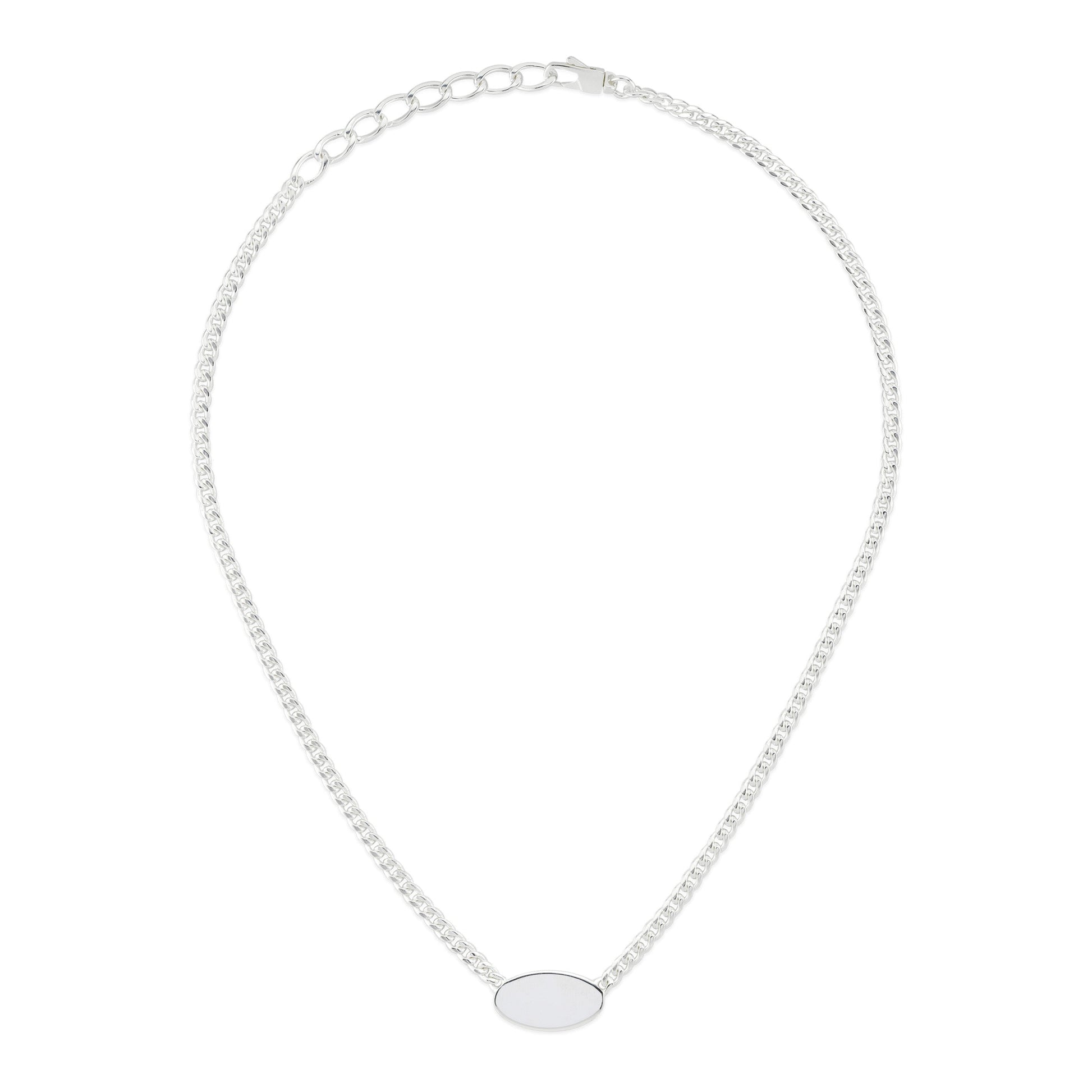 The Gucci Trademark Sterling Silver Tag Necklace Pendant by GUCCI Fine Jewellery features a sterling silver chain, an oval pendant, and an adjustable clasp for varied lengths. Its simple and elegant design includes a subtle trademark logo.