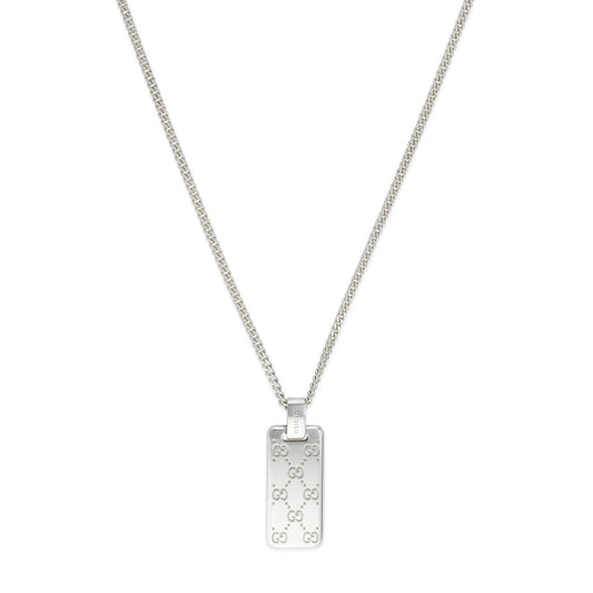 The Gucci Signature Sterling Silver Necklace from GUCCI Fine Jewellery showcases a rectangular pendant adorned with the iconic GG tags, suspended from a delicate chain. The pendant's repeated design radiates a chic and sophisticated aesthetic.