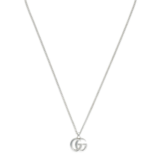 The Gucci GG Marmont Sterling Silver Necklace Pendant from GUCCI Fine Jewellery features a sleek chain with a double "G" emblem pendant, showcasing simple and elegant design.