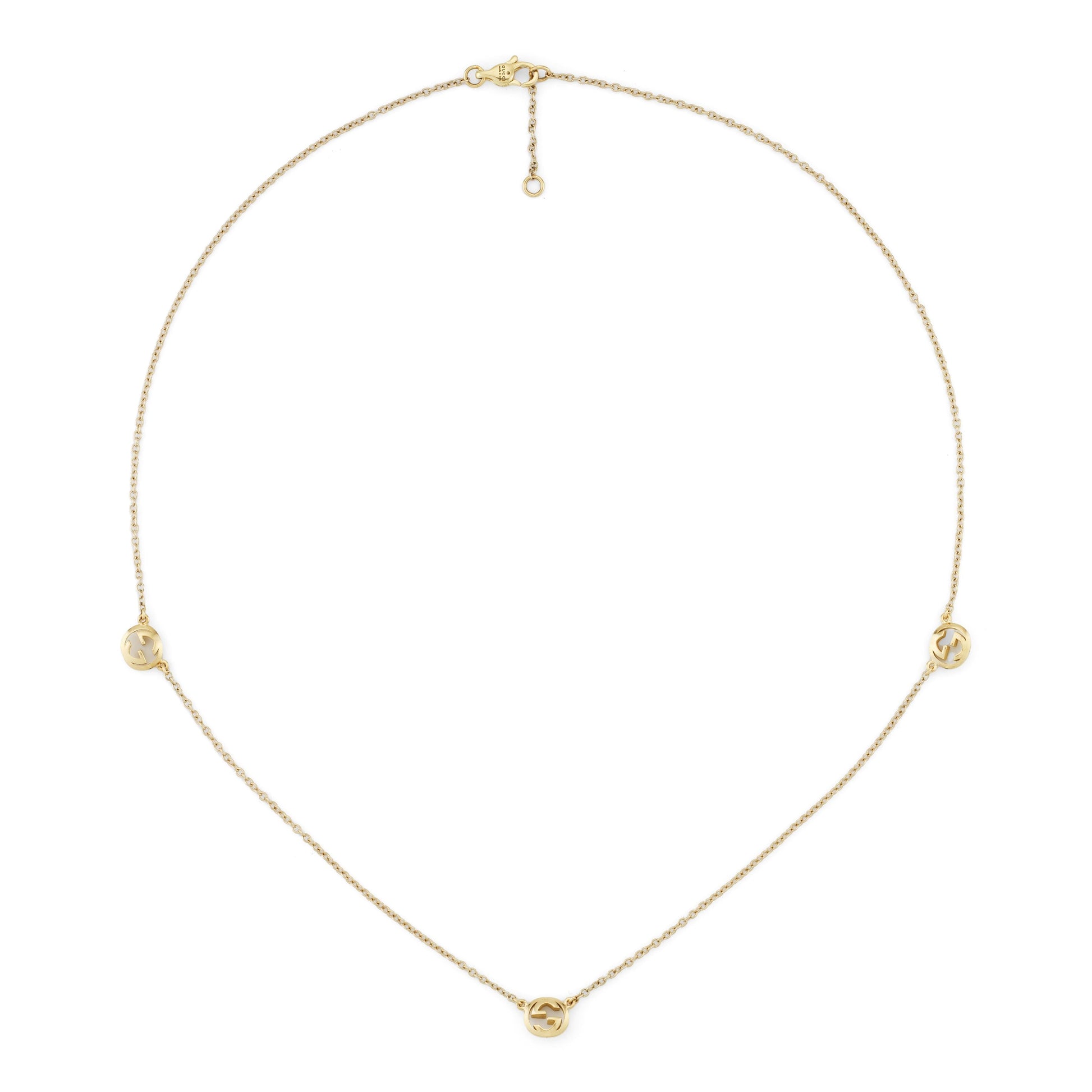 The Gucci Interlocking 18K Yellow Gold Necklace Pendant by GUCCI Fine Jewellery features three round cut-out charms on a delicate chain with an adjustable clasp.