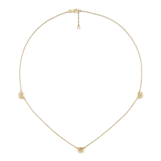 The Gucci Interlocking 18K Yellow Gold Necklace Pendant by GUCCI Fine Jewellery features three round cut-out charms on a delicate chain with an adjustable clasp.