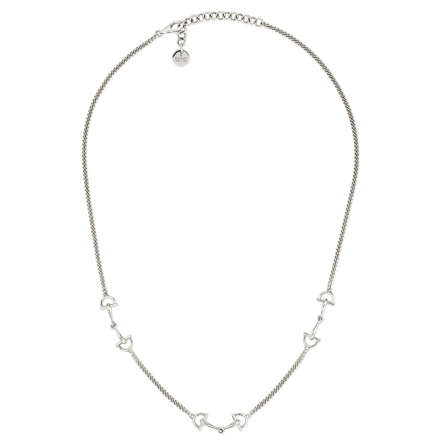 The Gucci Staffa Sterling Silver Station Necklace by GUCCI Fine Jewellery features small, evenly spaced horse bit-shaped charms and an adjustable clasp with a round tag, all crafted from sterling silver.