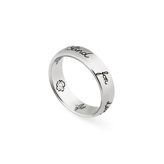 This Gucci Blind For Love sterling silver ring by GUCCI Fine Jewellery is adorned with symbolic motifs of delicate floral and leaf designs, offering a stylish and unique appearance. The polished metal finish adds to its charm, reminiscent of classic Gucci elegance.