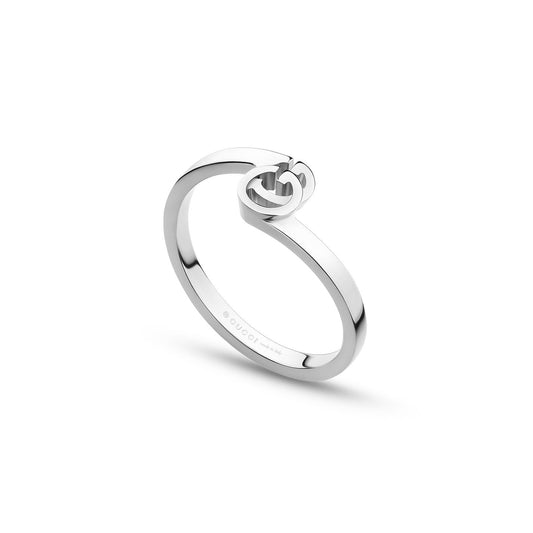 The Gucci Running G 18K White Gold Ring from GUCCI Fine Jewellery presents a sleek and minimalist design, highlighted by an intertwined "G" detail symbolizing the brand logo atop its polished silver surface. The ring features subtle branding engraved on the inner band.