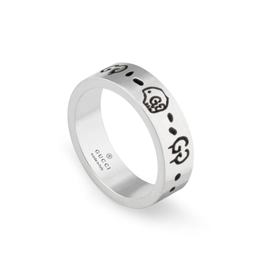 The Gucci Ghost Sterling Silver Ring from GUCCI Fine Jewellery features iconic logos and dotted patterns, capturing the essence of Trouble Andrew's Gucci Ghost style. The inner band is inscribed with "GUCCI" and "Made in Italy." Set against a plain white background, this ring exudes timeless elegance.