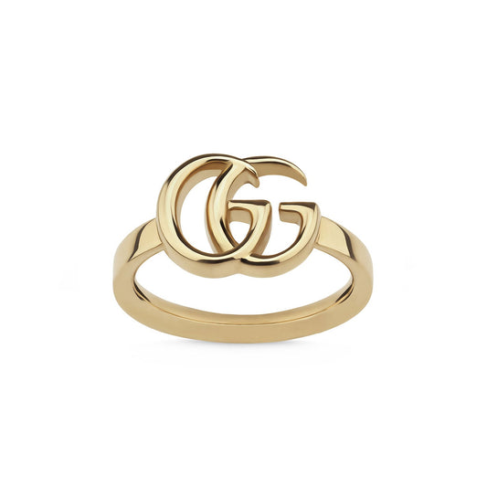 The Gucci Running G 18K Yellow Gold Ring from GUCCI Fine Jewellery features the signature Running G on a simplistic band, meticulously crafted in Italy, and displayed against a pure white backdrop.
