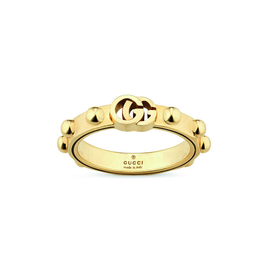 The Gucci Running G 18K Yellow Gold Ring by GUCCI Fine Jewellery showcases round studded details accompanied by the iconic interlocking double-G logo on top. The interior is elegantly engraved with "GUCCI" and "made in Italy." Available in size 6.75, it embodies timeless luxury.