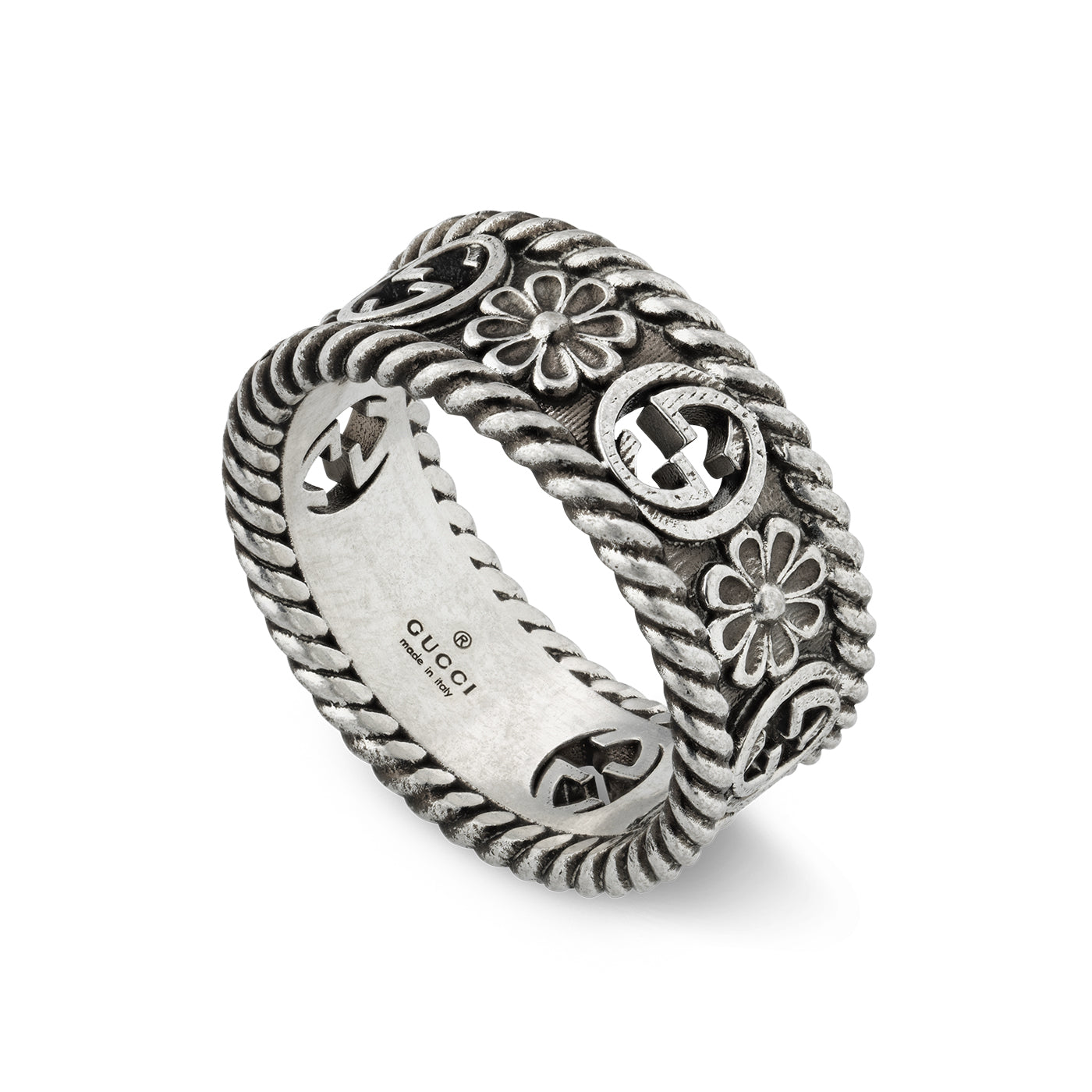 The Gucci Interlocking G Sterling Silver Ring from GUCCI Fine Jewellery features a rope-like texture adorned with interspersed flower motifs and a decorative pattern. The interior is engraved with the Gucci branding, hallmark details, and the iconic Interlocking G.