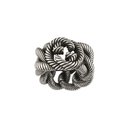 The Gucci Interlocking G Sterling Silver Ring from GUCCI Fine Jewellery boasts an intricate twisted rope design, offering a textured and detailed pattern. Its unique structure provides a sculptural, artistic appearance, with the iconic Interlocking G seamlessly integrated. The ring is elegantly displayed against a plain white background.