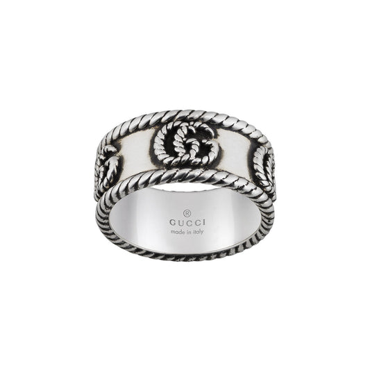 The Gucci Double G Sterling Silver Ring, crafted by GUCCI Fine Jewellery, features intricate rope detailing and embossed patterns on the band that highlight the sophistication of sterling silver craftsmanship. Exuding subtle elegance, this piece is quintessentially made in Italy.