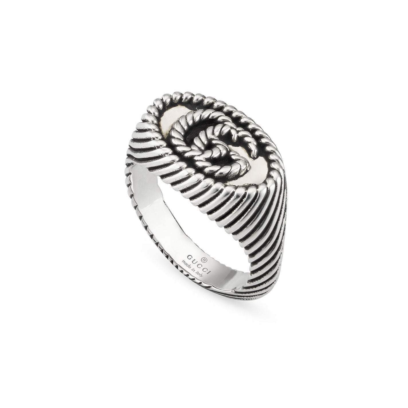 The Gucci Double G Chevalier Aged Sterling Silver Ring from GUCCI Fine Jewellery features a spiral rope design with textured stripes along the band. Its interior is engraved with the iconic Gucci logo, and a discreet Double G detail enhances its modern aesthetic, making it a striking piece.