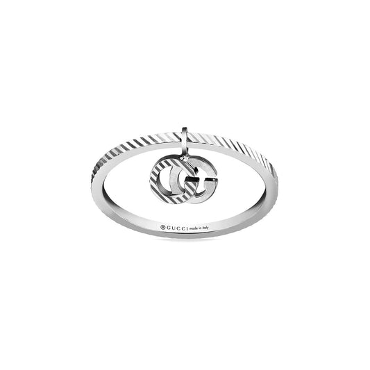 A silver bracelet featuring a circular charm at its center, adorned with the iconic Running G design. The bracelet displays a subtle striped pattern on its surface, and "Gucci made in Italy" is engraved on it.