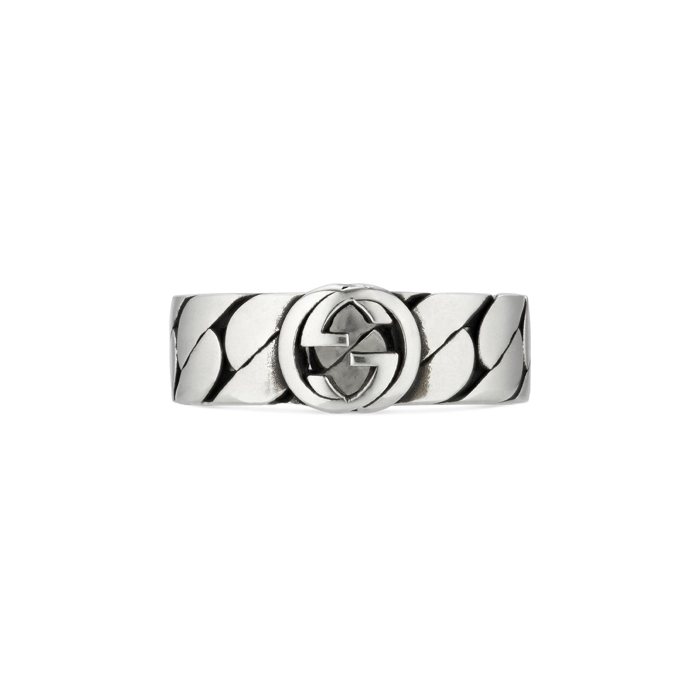 The Gucci Interlocking G Sterling Silver Ring by GUCCI Fine Jewellery features an embossed scale-like pattern in sterling silver. At its center, the iconic interlocking double G logo, a hallmark of Gucci, stands out. The polished finish accentuates the intricate design elements with subtle shadows.