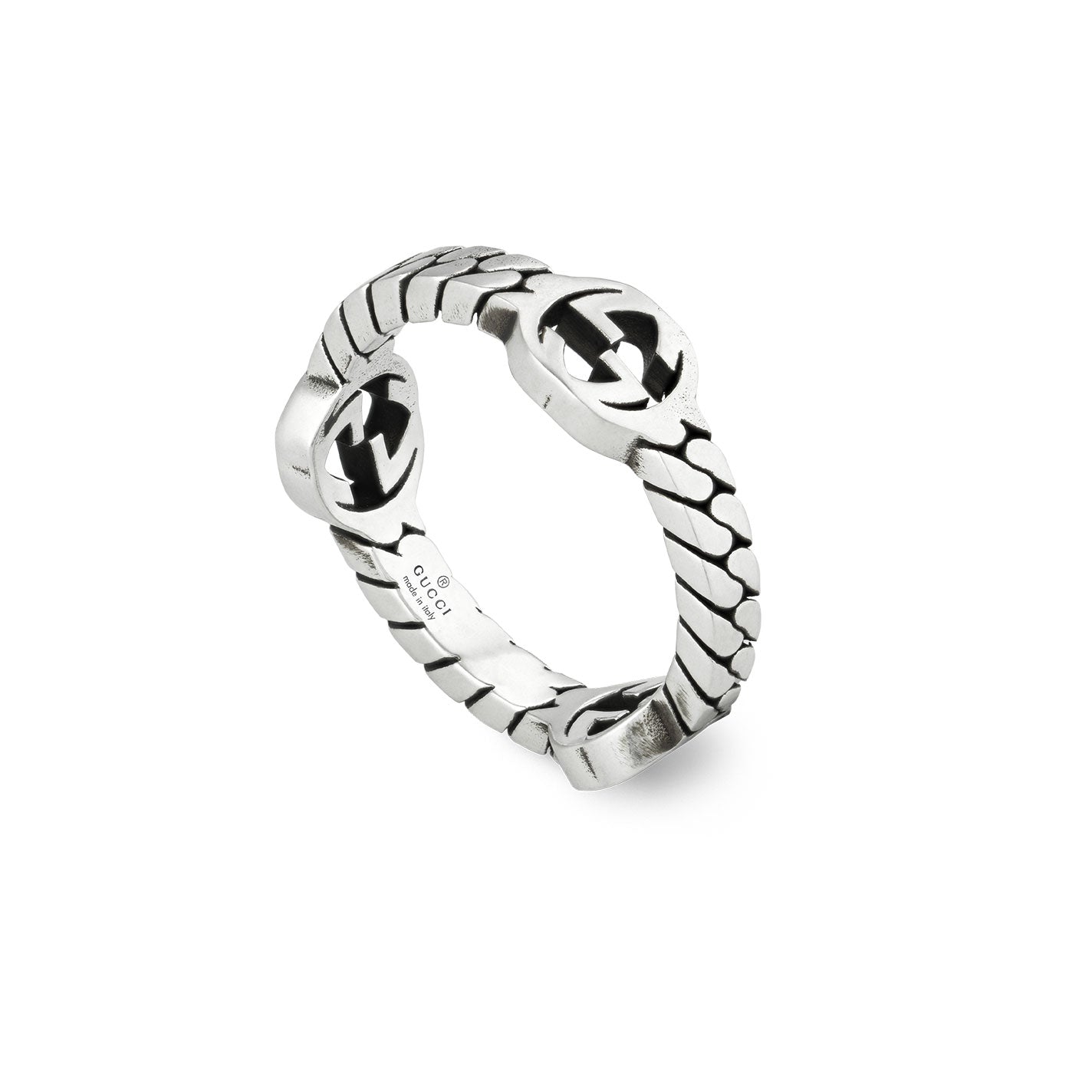 A Gucci Interlocking G Sterling Silver Ring from GUCCI Fine Jewellery, showcasing an intricate design with stylized letter motifs that is reminiscent of the brand's iconic style.