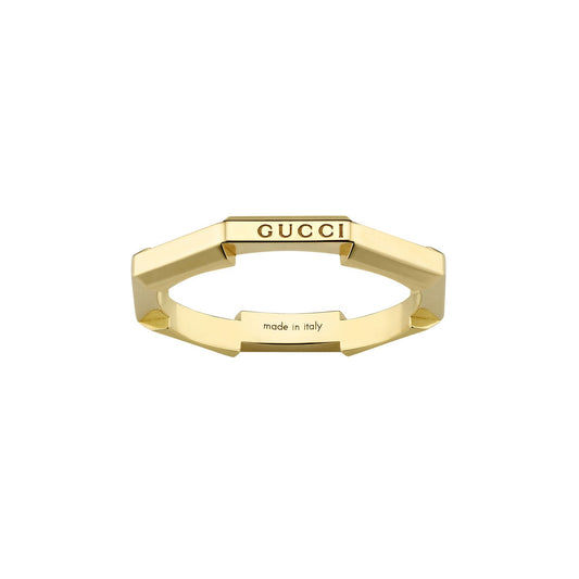 An 18K yellow gold geometric stackable ring engraved with "GUCCI" on the top and "made in Italy" inside, boasting angular edges and a sleek, modern aesthetic, from the Gucci Link to Love collection by GUCCI Fine Jewellery.