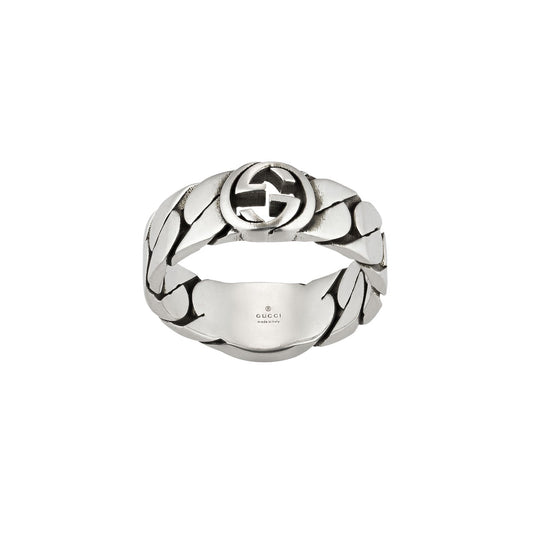 Introducing the Gucci Interlocking G Wide Sterling Silver Ring from GUCCI Fine Jewellery. This striking piece features a wide gourmette chain design with an enameled interlocking "G" logo at its center. Crafted from 925 sterling silver, the interior of the band is elegantly engraved with "Gucci" and "Made in Italy.