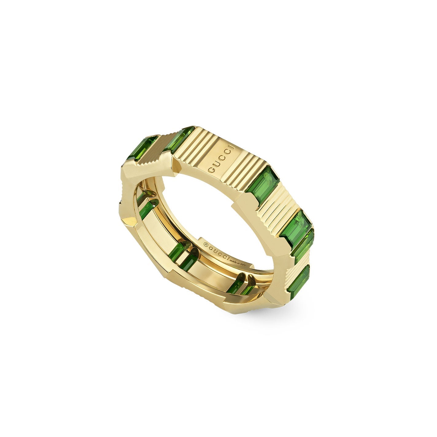 The Gucci Link to Love Tourmaline 18K Yellow Gold Ring by GUCCI Fine Jewellery embodies angular luxury with its rectangular green tourmaline gemstones and vertical ridges. The engraved logo accentuates its modern design, perfectly blending gold and green in a sleek and sophisticated style.