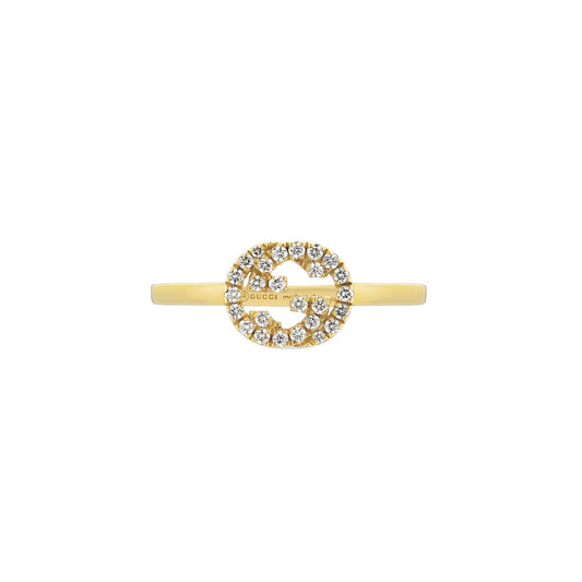 A GUCCI Fine Jewellery Interlocking G ring in 18K yellow gold, embellished with small, sparkling diamonds.