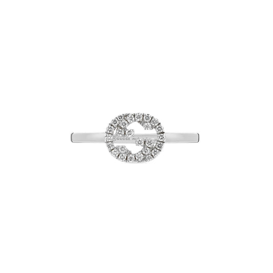 A Gucci Interlocking G ring crafted from 18K white gold, featuring a circular design with sparkling diamonds at its center, offers an elegant touch as part of the GUCCI Fine Jewellery collection.