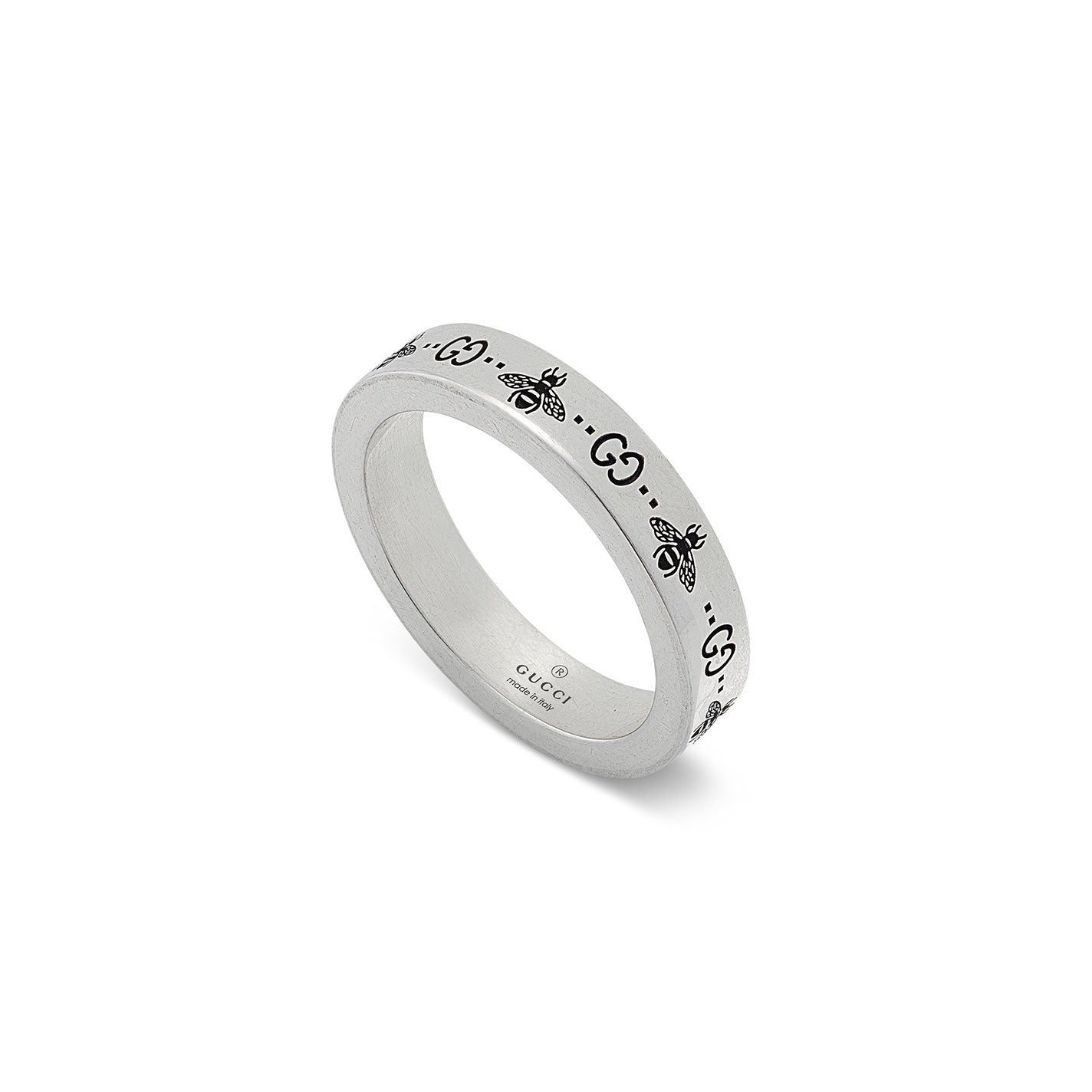 The Gucci GG And Bee Engraved Thin Sterling Silver Ring by GUCCI Fine Jewellery features intricate bee designs and interlocking G symbols around the band, creating a sophisticated and chic look.