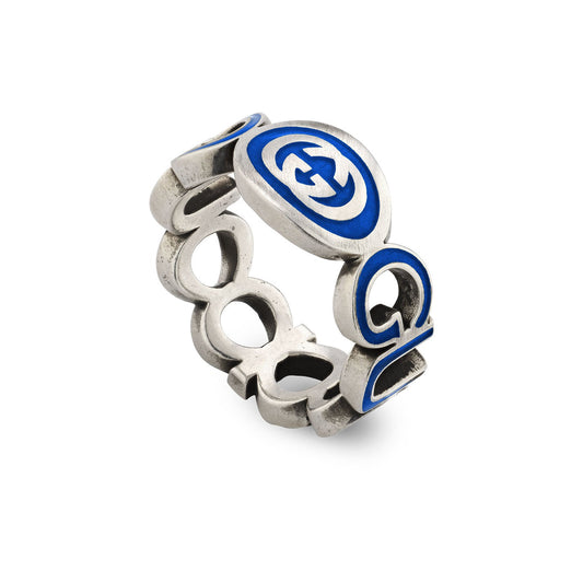 Experience the sophistication of the Gucci Interlocking G Enamel Sterling Silver Ring from GUCCI Fine Jewellery. This piece showcases abstract, intertwined shapes with blue enamel accents, incorporating circular and geometric elements that evoke a modern and artistic flair similar to a cut-out design.