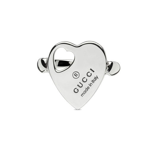 Heart-shaped silver accessory elegantly engraved with the "GUCCI" trademark and "made in italy," featuring two side handles and a small heart cutout. A stylish piece from GUCCI Fine Jewellery's Pre-Fall 2024 collection, showcasing the Gucci Trademark Sterling Silver Heart design.