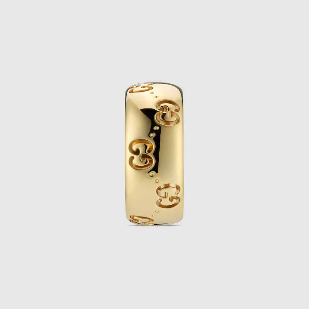 The Gucci Icon GG 18K Yellow Gold GG Wide Ring from GUCCI Fine Jewellery highlights the polished and sophisticated style of Gucci jewelry with its elegant gold curved band featuring a repeating interlocking "G" design.