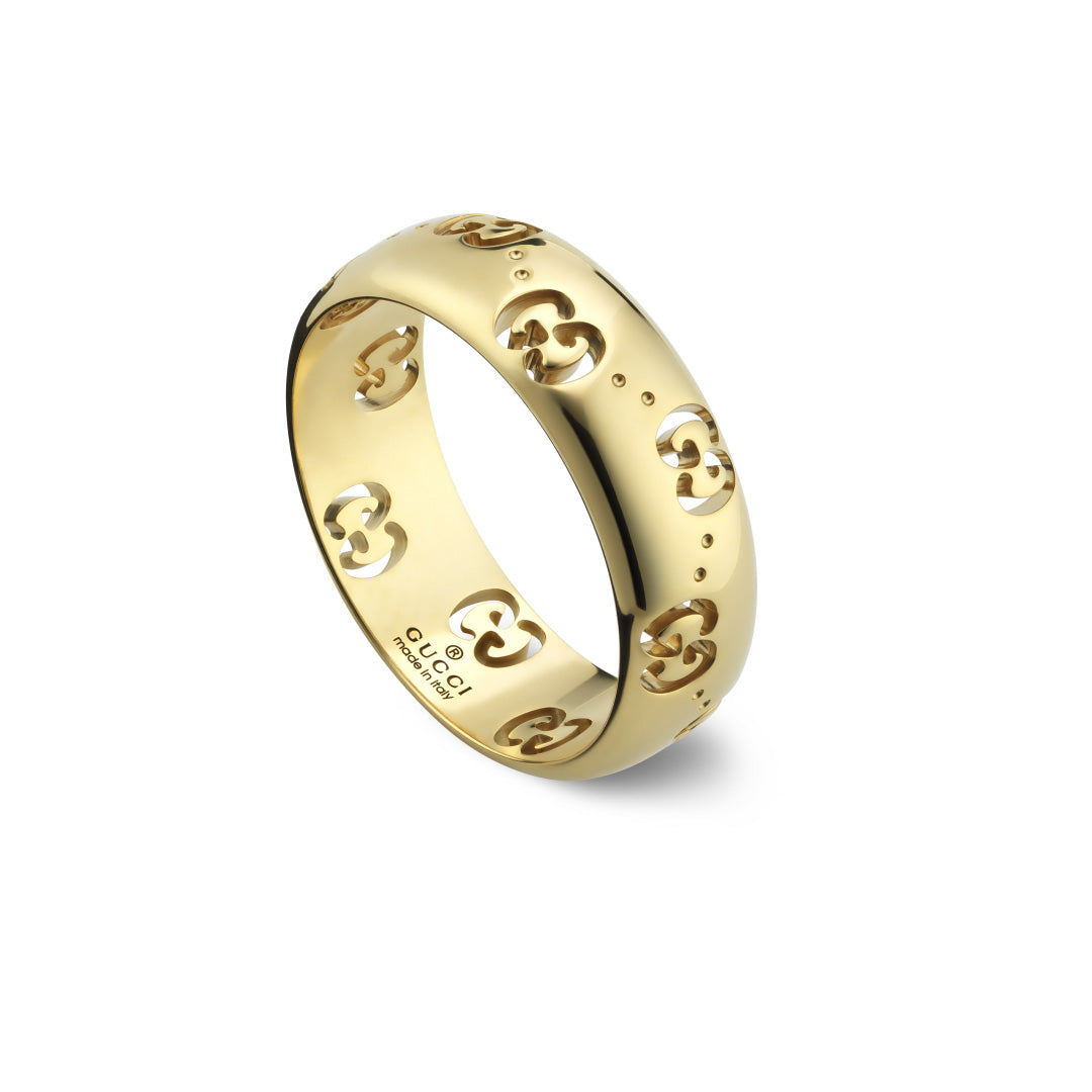 The Gucci Icon GG 18K Yellow Gold GG Thin Ring by GUCCI Fine Jewellery is crafted from 18k yellow gold and showcases cut-out designs of interlocking "G" logos. The interior is elegantly engraved with Gucci jewelry branding details.