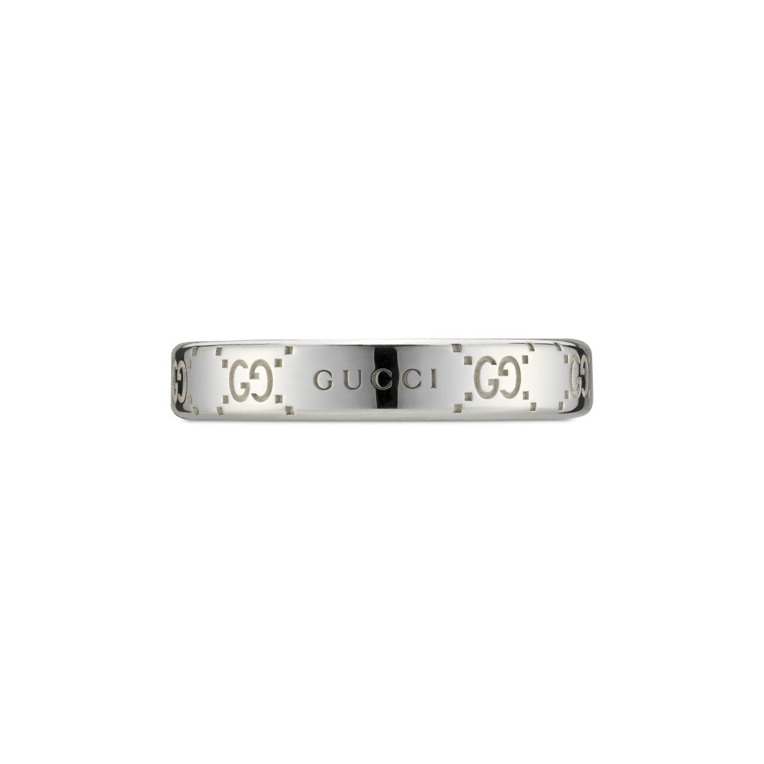 Crafted from sterling silver, the Gucci Signature GG Sterling Silver Thin Ring by GUCCI Fine Jewellery features engraved interlocking "G" logos on its sides and a "GUCCI" engraving at the front center. The sleek and polished band highlights the iconic GG motif, exemplifying the brand's signature style.