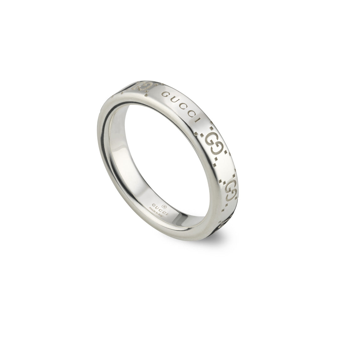 The Gucci Signature GG Sterling Silver Thin Ring by GUCCI Fine Jewellery features the iconic GG motif engraved repeatedly around its surface. With a polished and reflective finish, the ring exudes a simple yet elegant design.