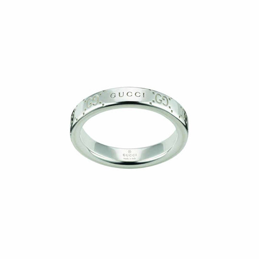 A sterling silver thin ring by GUCCI Fine Jewellery, showcasing the engraved Gucci logo and the iconic GG motif elegantly interlocking on the band.