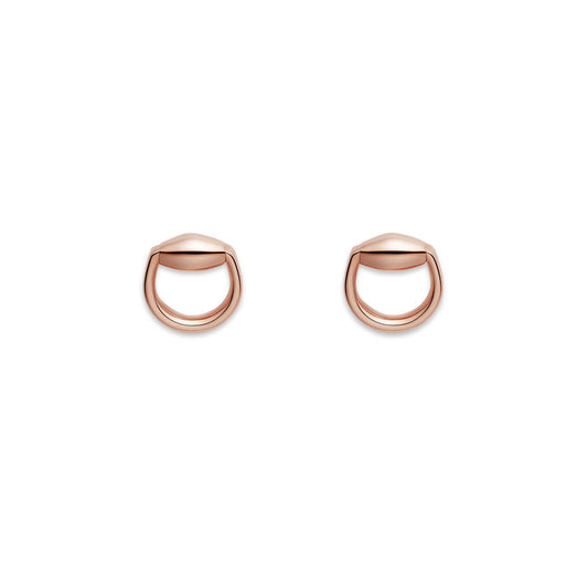 A pair of Gucci Horsebit 18K Rose Gold Stud Earrings from GUCCI Fine Jewellery, showcasing a distinctive geometric design. The smooth finish evokes a stylized horseshoe, reminiscent of the iconic horsebit shape, set against a plain white background.