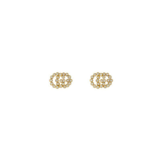 A pair of Gucci GG Running 18K Yellow Gold Diamond Stud Earrings from GUCCI Fine Jewellery features a circular interlocking design embedded with tiny, brilliant diamonds, all set against a plain white background.