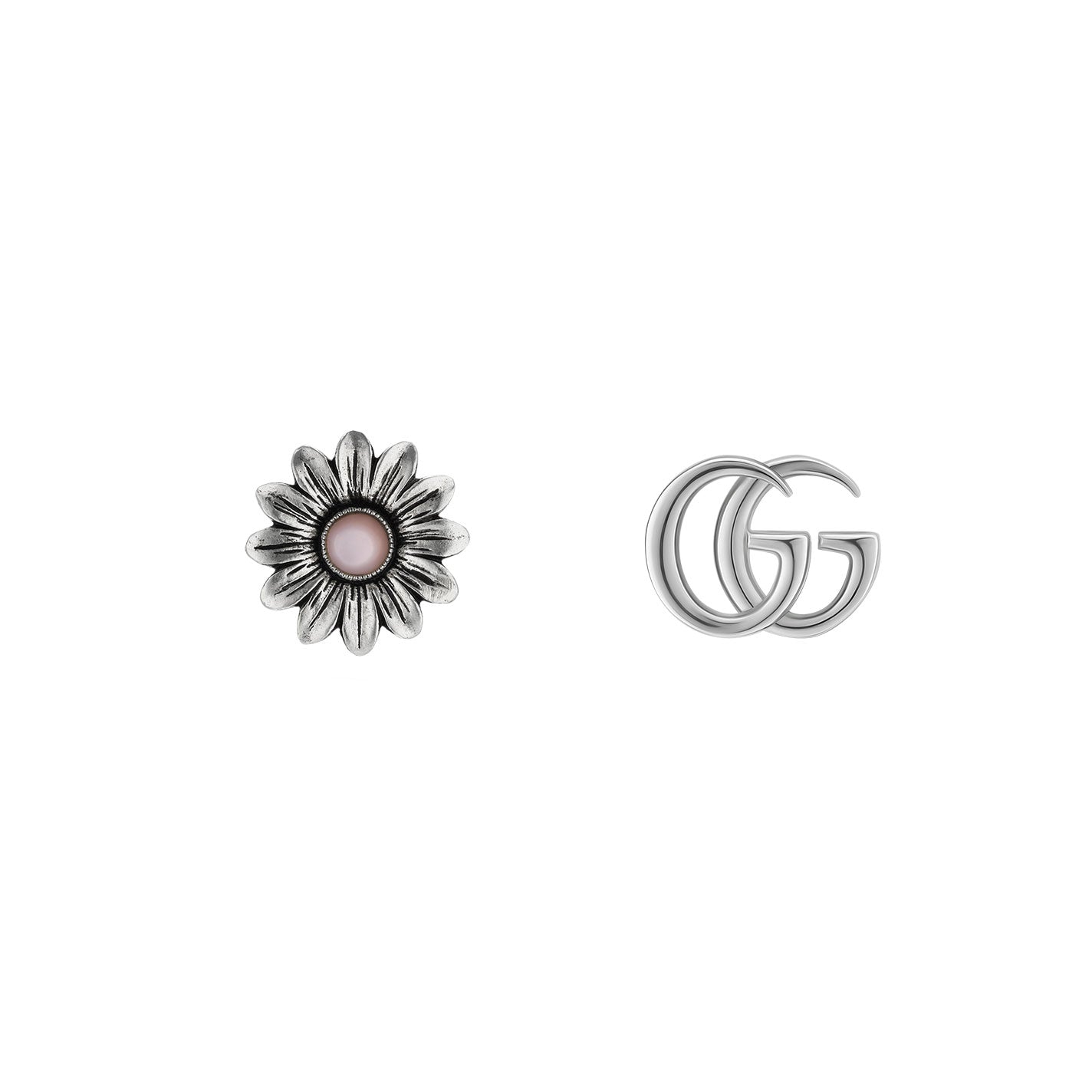 A pair of metallic objects on a white background: on the left is a silver flower with a pink center, while on the right are elegant sterling silver interlocking 'G' letters, resembling the Gucci Double G Flower Sterling Silver Stud Earrings by GUCCI Fine Jewellery.