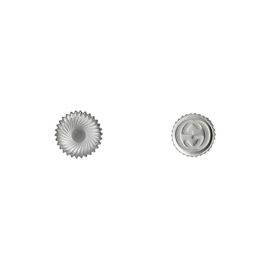 Gucci Boule Interlocking G Sterling Silver Stud Earrings from GUCCI Fine Jewellery feature a sterling silver design. One earring showcases a scalloped, embossed pattern, while the other displays a timeless circular logo, creating an elegant and sophisticated touch to any ensemble.