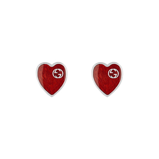 The Gucci Interlocking G Sterling Silver Stud Earrings from GUCCI Fine Jewellery feature a striking red enamel design accented with a faint white logo, elegantly outlined in textured 925 sterling silver.
