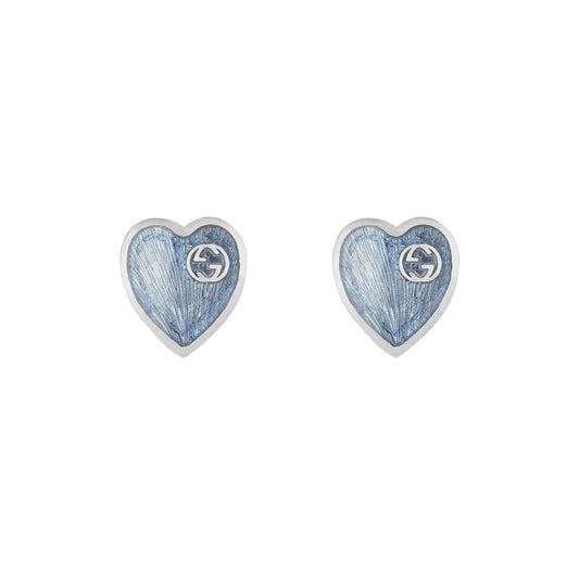Gucci's Interlocking G sterling silver stud earrings with blue enamel, featuring a textured surface and small logo detail, epitomize the elegance of GUCCI Fine Jewellery.